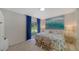 Main bedroom with king bed and sliding door to backyard at 1411 Quail Dr, Sarasota, FL 34231