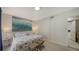 Main bedroom with king-size bed and access to bathroom at 1411 Quail Dr, Sarasota, FL 34231
