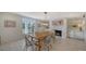Bright dining room featuring a wood table and fireplace at 1411 Quail Dr, Sarasota, FL 34231