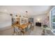 Spacious dining area with wood table and access to kitchen at 1411 Quail Dr, Sarasota, FL 34231