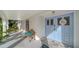 Inviting front porch with light blue double doors and a wooden bench at 1411 Quail Dr, Sarasota, FL 34231