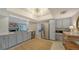 Updated kitchen, stainless steel appliances, and light blue cabinets at 1411 Quail Dr, Sarasota, FL 34231