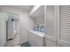 Convenient laundry room with washer, dryer, and extra storage at 1411 Quail Dr, Sarasota, FL 34231