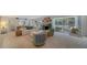 Living room with fireplace, pool view, and ample seating at 1411 Quail Dr, Sarasota, FL 34231