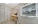 Bright home office featuring a desk and built-in closet at 1411 Quail Dr, Sarasota, FL 34231