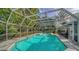 Inviting screened pool with plenty of space for relaxation at 1411 Quail Dr, Sarasota, FL 34231