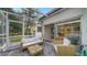 Relaxing screened patio with seating and access to the backyard at 1411 Quail Dr, Sarasota, FL 34231
