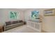 Cozy sitting area with a comfortable couch and storage cabinet at 1411 Quail Dr, Sarasota, FL 34231