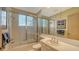 Bathroom with tub, shower, and double vanity at 1560 Harbor Sound Dr, Longboat Key, FL 34228