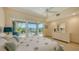 Bedroom with water views and ample dresser space at 1560 Harbor Sound Dr, Longboat Key, FL 34228