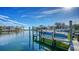 Private boat dock with a covered slip and open water access at 1560 Harbor Sound Dr, Longboat Key, FL 34228