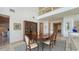 Formal dining room with large windows and hardwood floors at 1560 Harbor Sound Dr, Longboat Key, FL 34228