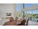 Bright dining area with water views and patio access at 1560 Harbor Sound Dr, Longboat Key, FL 34228