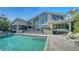 Stunning waterfront home with a large pool and patio at 1560 Harbor Sound Dr, Longboat Key, FL 34228