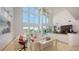 Bright living room with high ceilings and water views at 1560 Harbor Sound Dr, Longboat Key, FL 34228