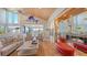 Spacious living room with a fireplace and access to a sunroom at 1560 Harbor Sound Dr, Longboat Key, FL 34228