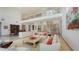 Open floorplan living room with high ceilings and neutral decor at 1560 Harbor Sound Dr, Longboat Key, FL 34228