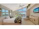 Main bedroom with water views and walk-in closet at 1560 Harbor Sound Dr, Longboat Key, FL 34228