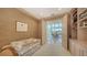 Home office with built-in shelving and view to dining area at 1560 Harbor Sound Dr, Longboat Key, FL 34228