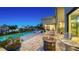 Expansive patio with fire pit, overlooking the water at 1560 Harbor Sound Dr, Longboat Key, FL 34228