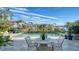 Inviting pool and patio area with water views at 1560 Harbor Sound Dr, Longboat Key, FL 34228