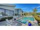 Inviting pool and spa area with ample patio space for lounging at 1560 Harbor Sound Dr, Longboat Key, FL 34228