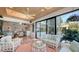 Bright sunroom with water views and access to backyard at 1560 Harbor Sound Dr, Longboat Key, FL 34228