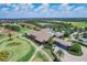 Aerial view of clubhouse, golf course, and parking at 16003 Kendleshire Ter, Lakewood Ranch, FL 34202