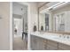 Elegant bathroom with dual vanity and a large mirror at 16003 Kendleshire Ter, Lakewood Ranch, FL 34202