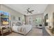 Serene main bedroom with a king-size bed and access to a private bath at 16003 Kendleshire Ter, Lakewood Ranch, FL 34202