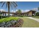 Landscaped clubhouse exterior with palm trees at 16003 Kendleshire Ter, Lakewood Ranch, FL 34202