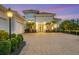 Beautiful home with a paver driveway and manicured landscaping at 16003 Kendleshire Ter, Lakewood Ranch, FL 34202