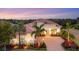 Luxury home with a paver driveway and lush landscaping at 16003 Kendleshire Ter, Lakewood Ranch, FL 34202
