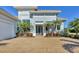 Modern home with paver driveway and tropical landscaping at 16003 Kendleshire Ter, Lakewood Ranch, FL 34202