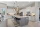 Modern kitchen features a spacious island and white cabinetry at 16003 Kendleshire Ter, Lakewood Ranch, FL 34202