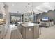 Open concept kitchen with island, stainless steel appliances, and views to backyard at 16003 Kendleshire Ter, Lakewood Ranch, FL 34202