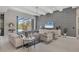Spacious living room with contemporary furniture and large TV at 16003 Kendleshire Ter, Lakewood Ranch, FL 34202
