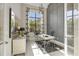 Home office with large window and built-in shelving at 16003 Kendleshire Ter, Lakewood Ranch, FL 34202