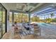 Spacious covered patio with fire pit and pool view at 16003 Kendleshire Ter, Lakewood Ranch, FL 34202