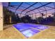 Night view of a gorgeous, screened pool and spa at 16003 Kendleshire Ter, Lakewood Ranch, FL 34202