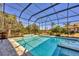 Inviting screened pool and spa with sunning area at 16003 Kendleshire Ter, Lakewood Ranch, FL 34202