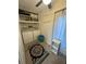 Laundry room with washer, dryer, and storage shelves at 1832 Sunny Dr # D32, Bradenton, FL 34207