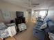 Living room with a blue couch and comfy armchair at 1832 Sunny Dr # D32, Bradenton, FL 34207