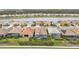Aerial view of neighborhood with lake and houses at 20296 Bandera Pl, Venice, FL 34293