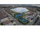 Community pool, tennis courts, playground, and lake at 20296 Bandera Pl, Venice, FL 34293