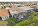 House with pool and screened enclosure, aerial view at 20296 Bandera Pl, Venice, FL 34293