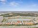 Aerial view of a single house and surrounding community at 20296 Bandera Pl, Venice, FL 34293