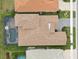 Overhead view of house, pool, and surrounding landscape at 20296 Bandera Pl, Venice, FL 34293