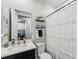 Simple bathroom with a shower/tub combo and updated fixtures at 20296 Bandera Pl, Venice, FL 34293