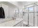 Modern bathroom with a large shower and quartz countertop at 20296 Bandera Pl, Venice, FL 34293